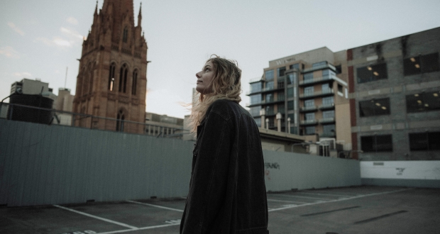 Woman staring at a church