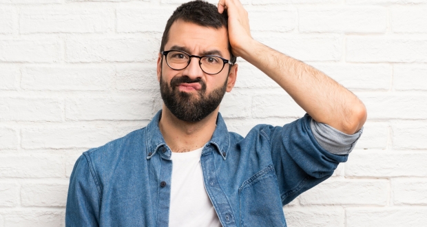 Man scratching his head