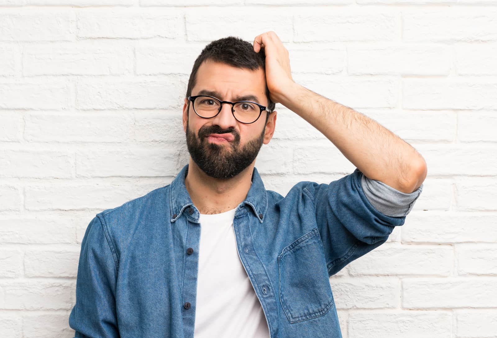 Man scratching his head