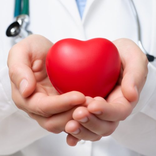 Doctor protecting a heart